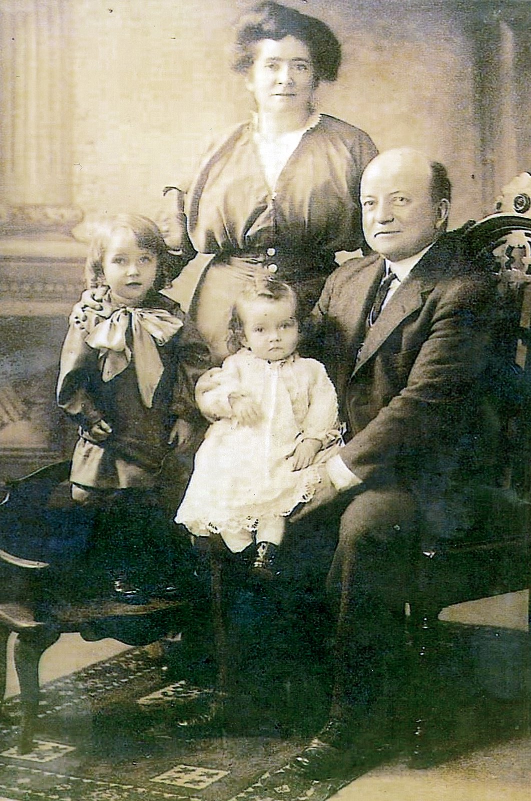 In the photo are: Elizabeth Frances Duffy (1877–1945), Daniel E. Duffy (1868–1930), Paul Duffy (1911–1918), and Mary Loretta Duffy Parker (1913–1986). Loretta, is Abigail Parker’s paternal grandmother.