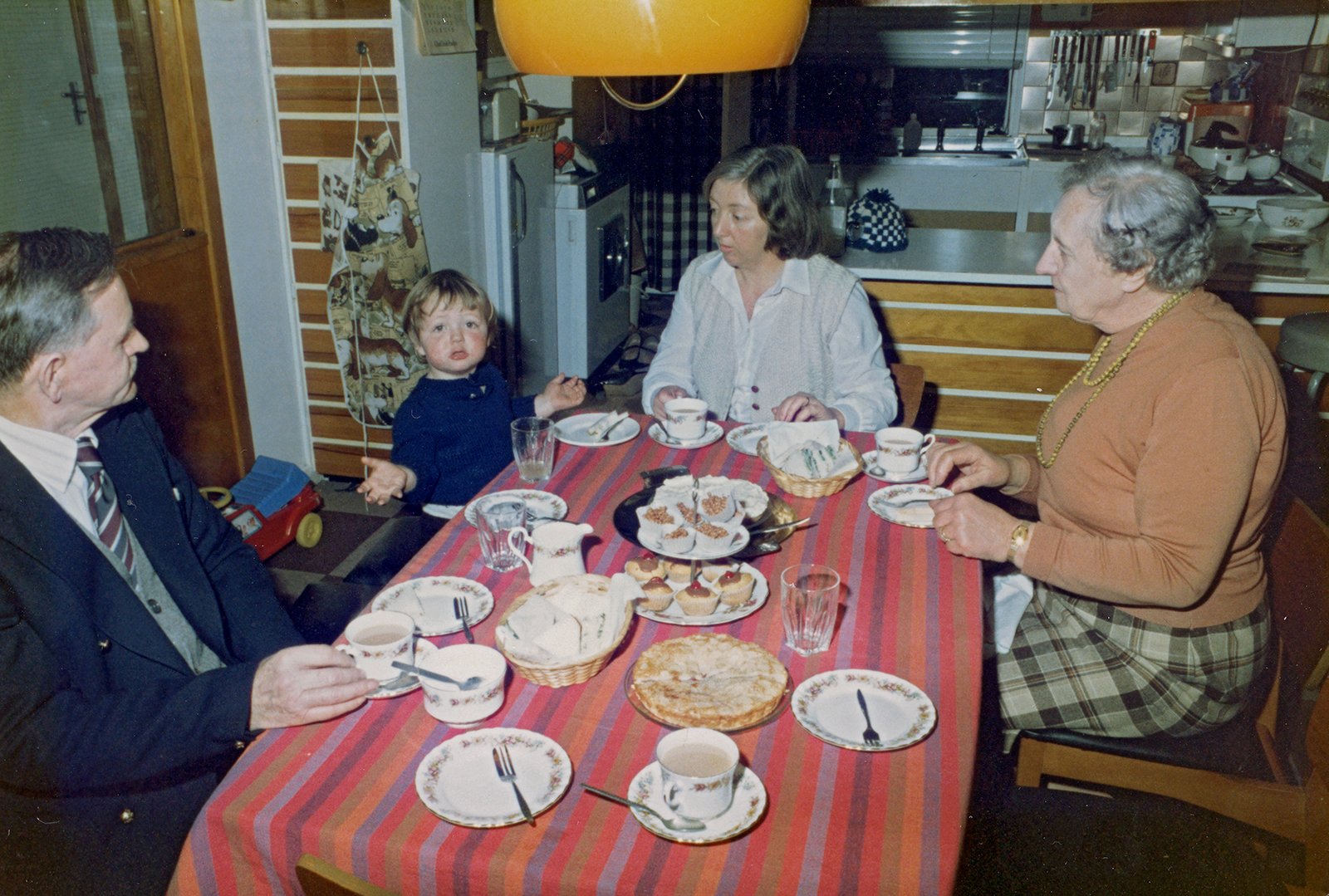 Andrew holds forth at tea-time, with his grandfather Hugh Hetherington, mother Terry and grandmother Dorothy, Dublin, 1970.