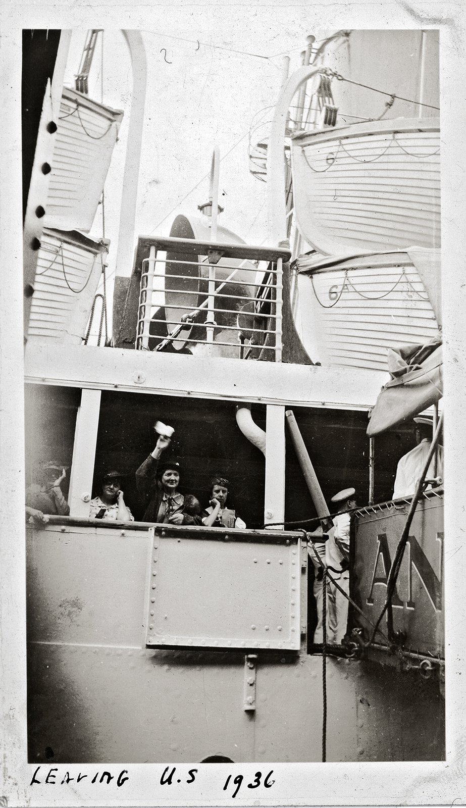 View of boat leaving docks, 1936.
