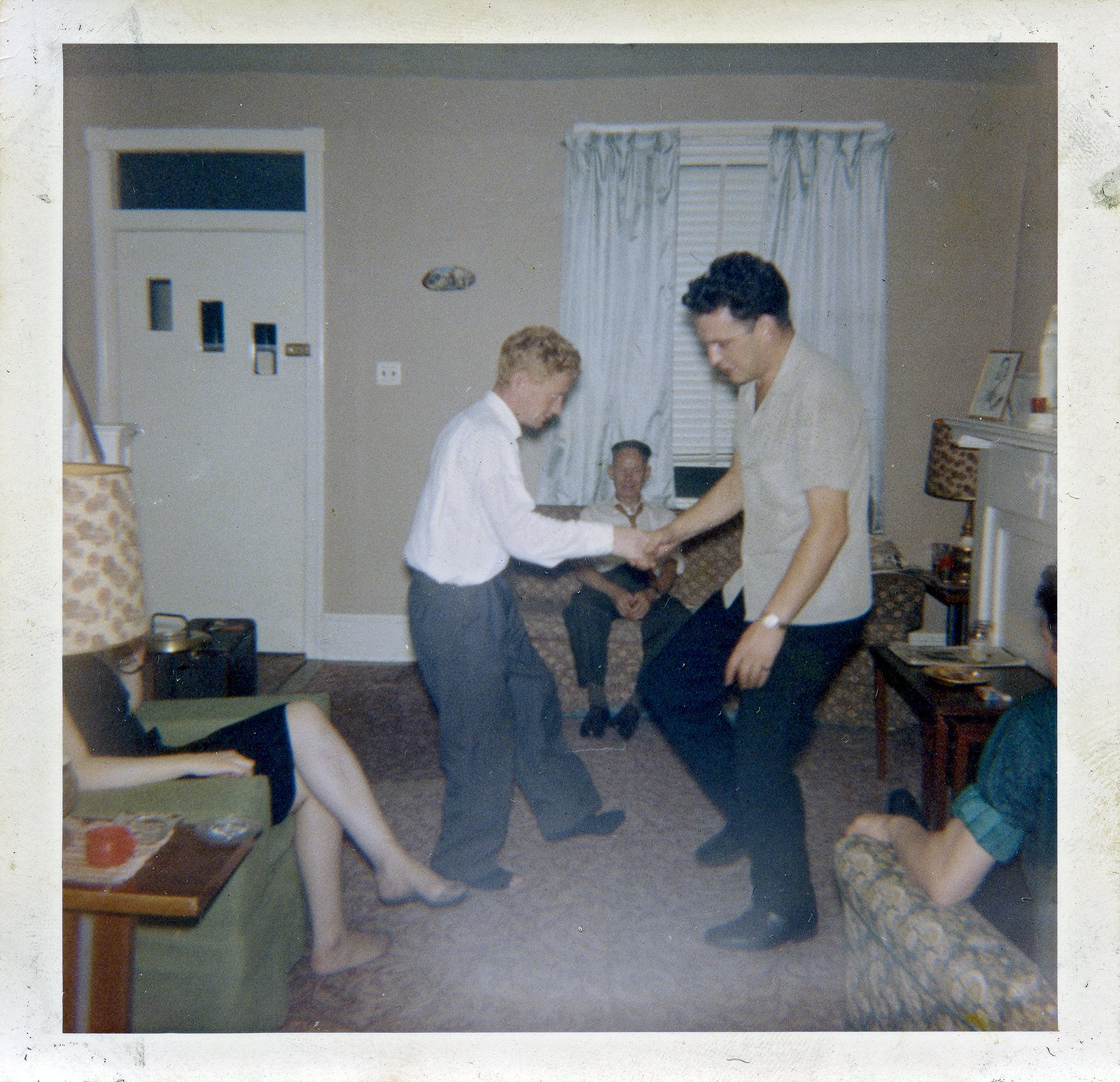 Men set dancing at a house party in Germantown, Philadelphia in the early 1960s.