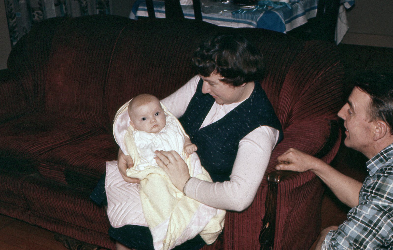 Pam holding first born Maeve, Cecil looking on at the right, Vancouver, 23 October 1959.