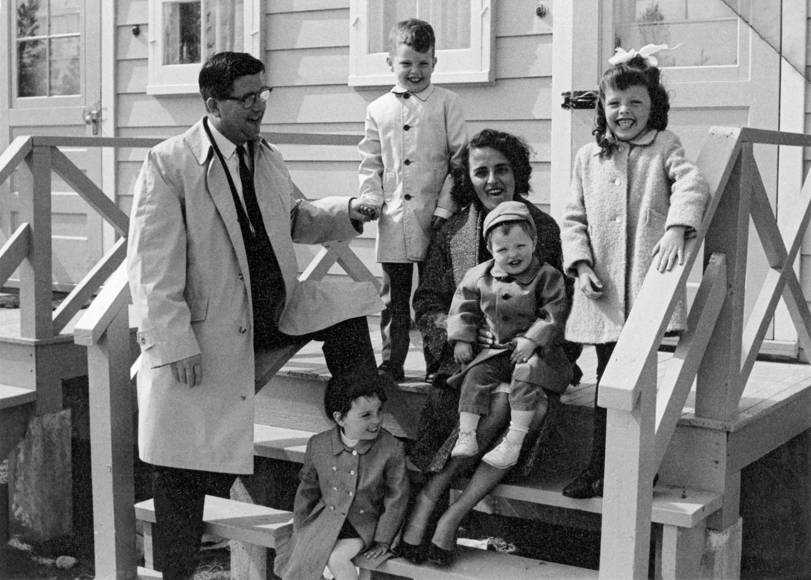 Family posing on the steps of their home, Whitehorse, Yukon, 1966.
