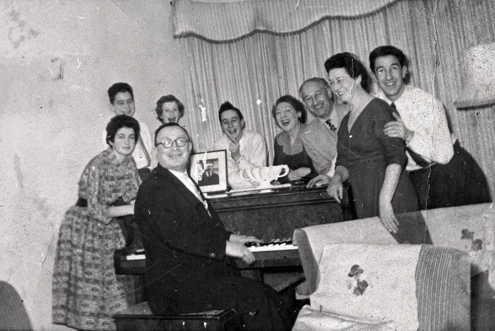 Hyman Shaper entertaining his family and relatives, c. 1956.