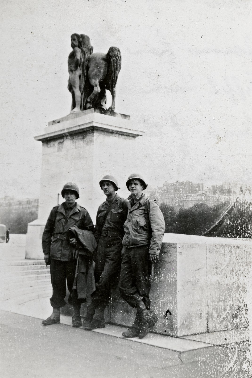 William McDermott, Alice's father, Paris, August 29, 1944, across from the Eiffel Tower on the banks of the River Seine, with Rosen and Campbell (annotated on back)