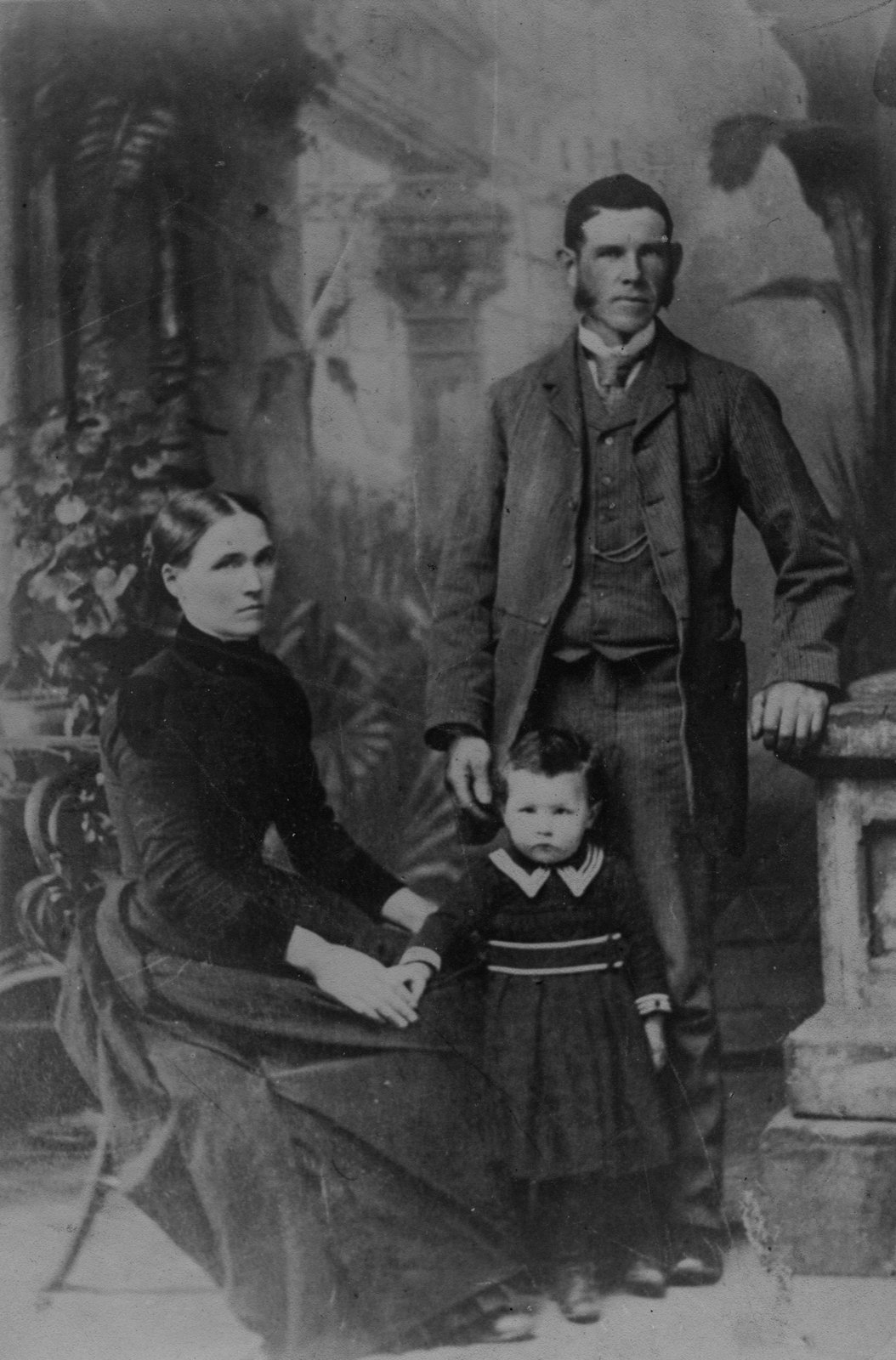 James McCoy (great grandfather of the album owner), pictured with his wife (nee O’Hanlon) & their infant son John McCoy. John McCoy was born in 1889, dating this photograph to 1890 or ’91.