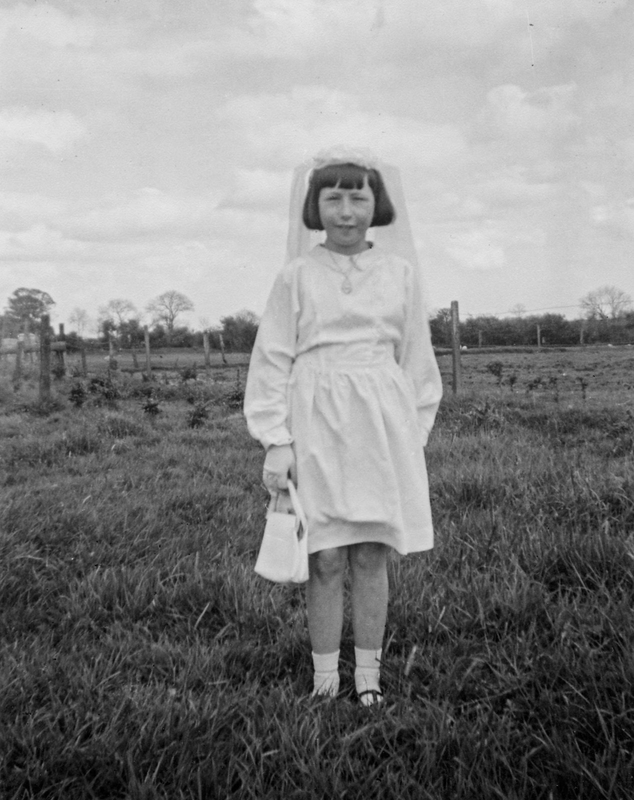 Mid-1960s First Holy Communion photograph of Kathleen McGing at her home in Moynalvey, County Meath.