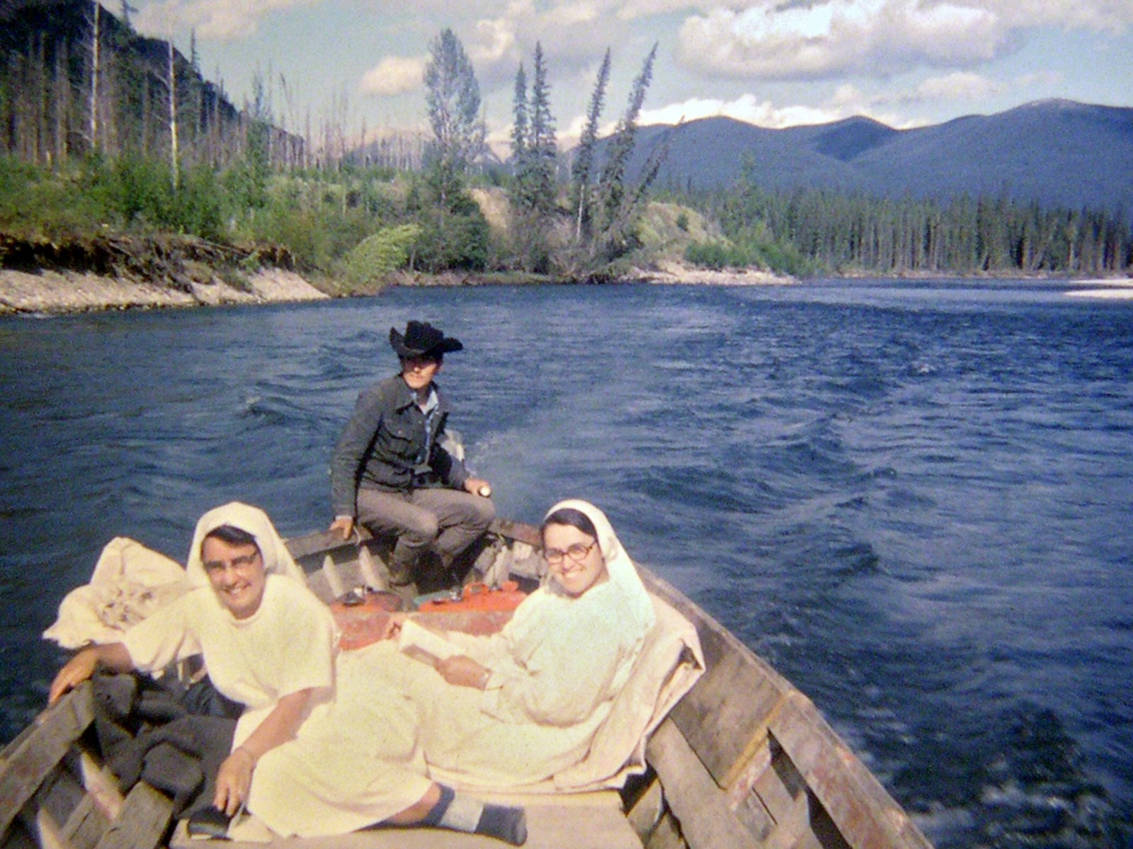 Chief Emil McCook, bringing visiting nuns up the Finlay river, July 1972.